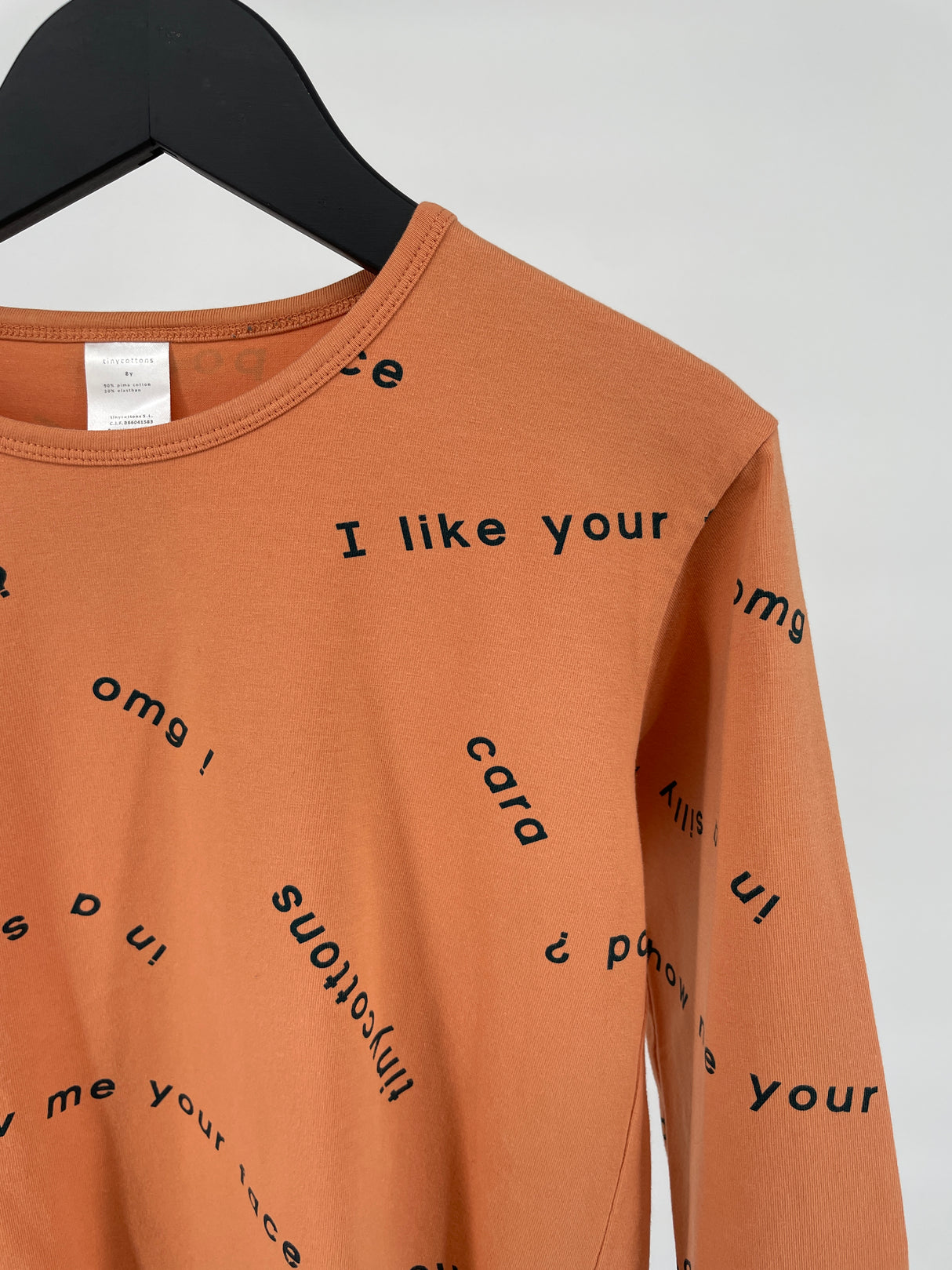 Longsleeve Oranje Woorden Print Maat 128